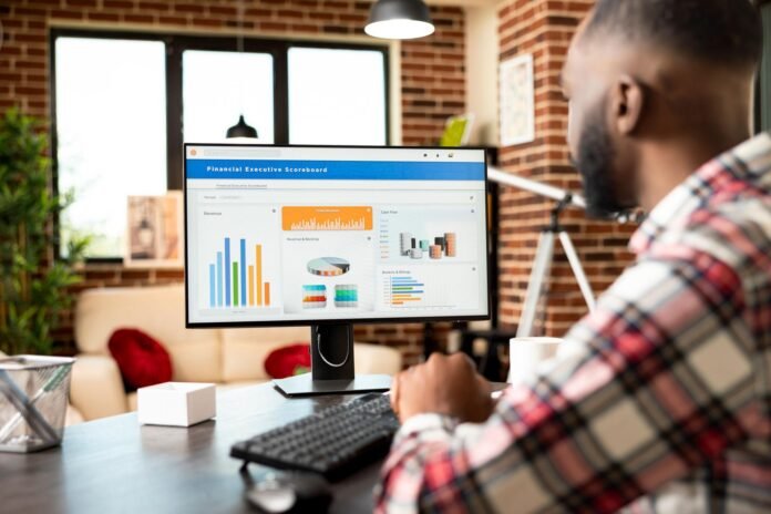Entrepreneur reviewing financial reports and investment performance
