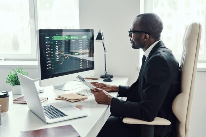 African entrepreneur reviewing investment opportunities and financial growth strategies