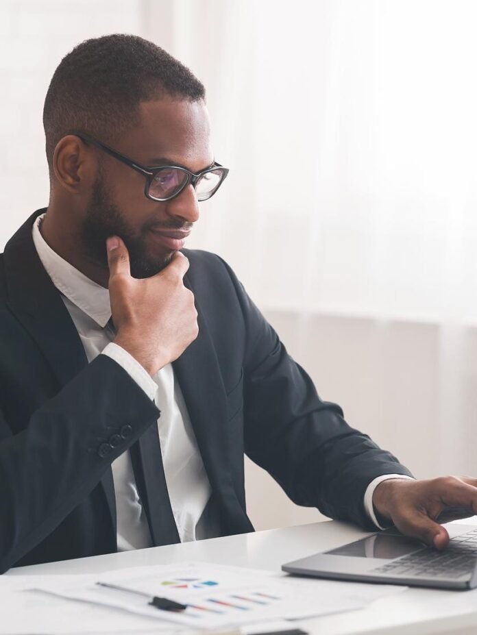 African entrepreneur reviewing long term business growth strategy