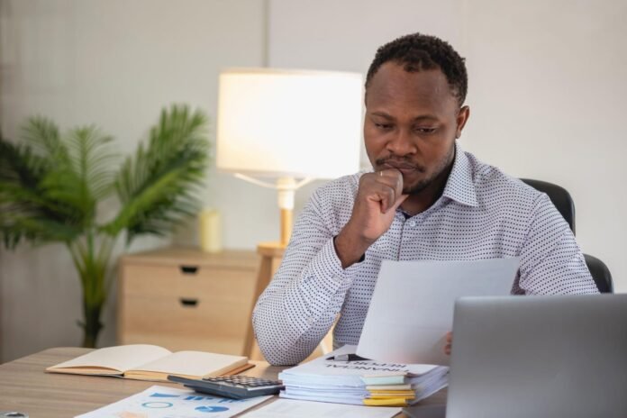 African entrepreneur reviewing wealth creation strategy and long term business growth plans