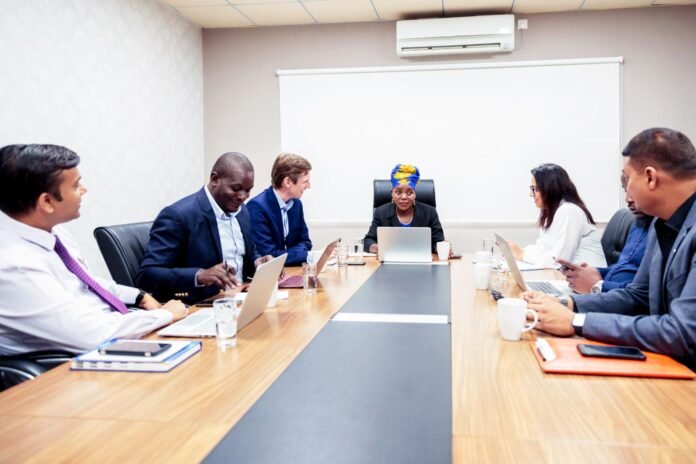 African business leader guiding a team during a strategic meeting